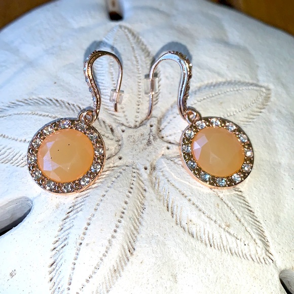 Peach colored earrings surrounded by crystals. - Picture 5 of 5